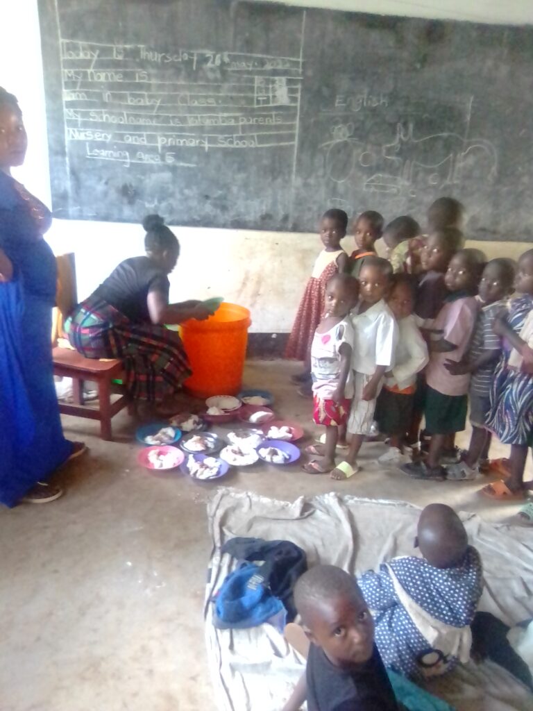 Nursery children line up for breakfast